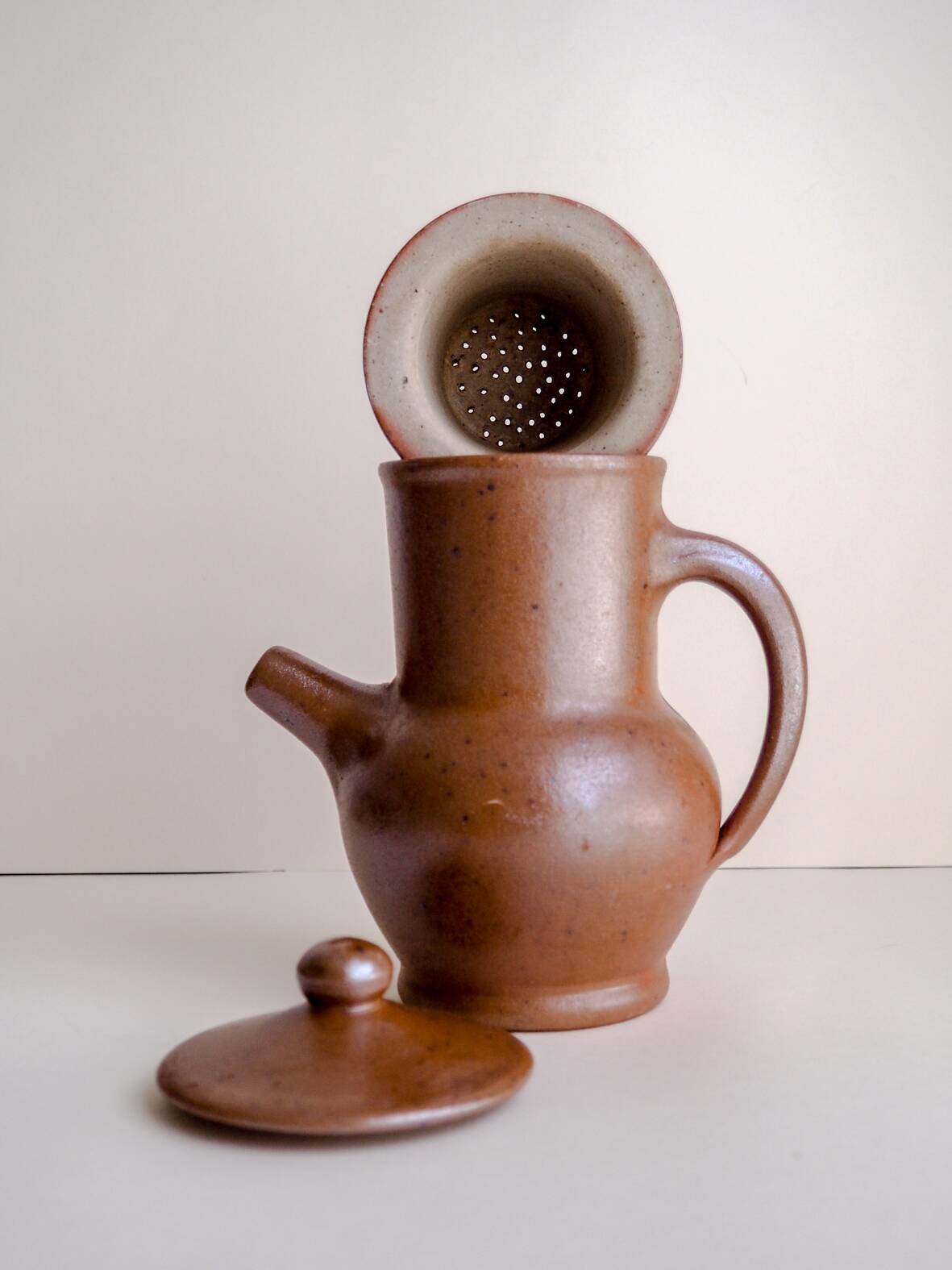 Handcrafted stoneware teapot with strainer