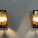 Mid-century pair of wall sconces in textured glass and brass, 1950s, Germany.