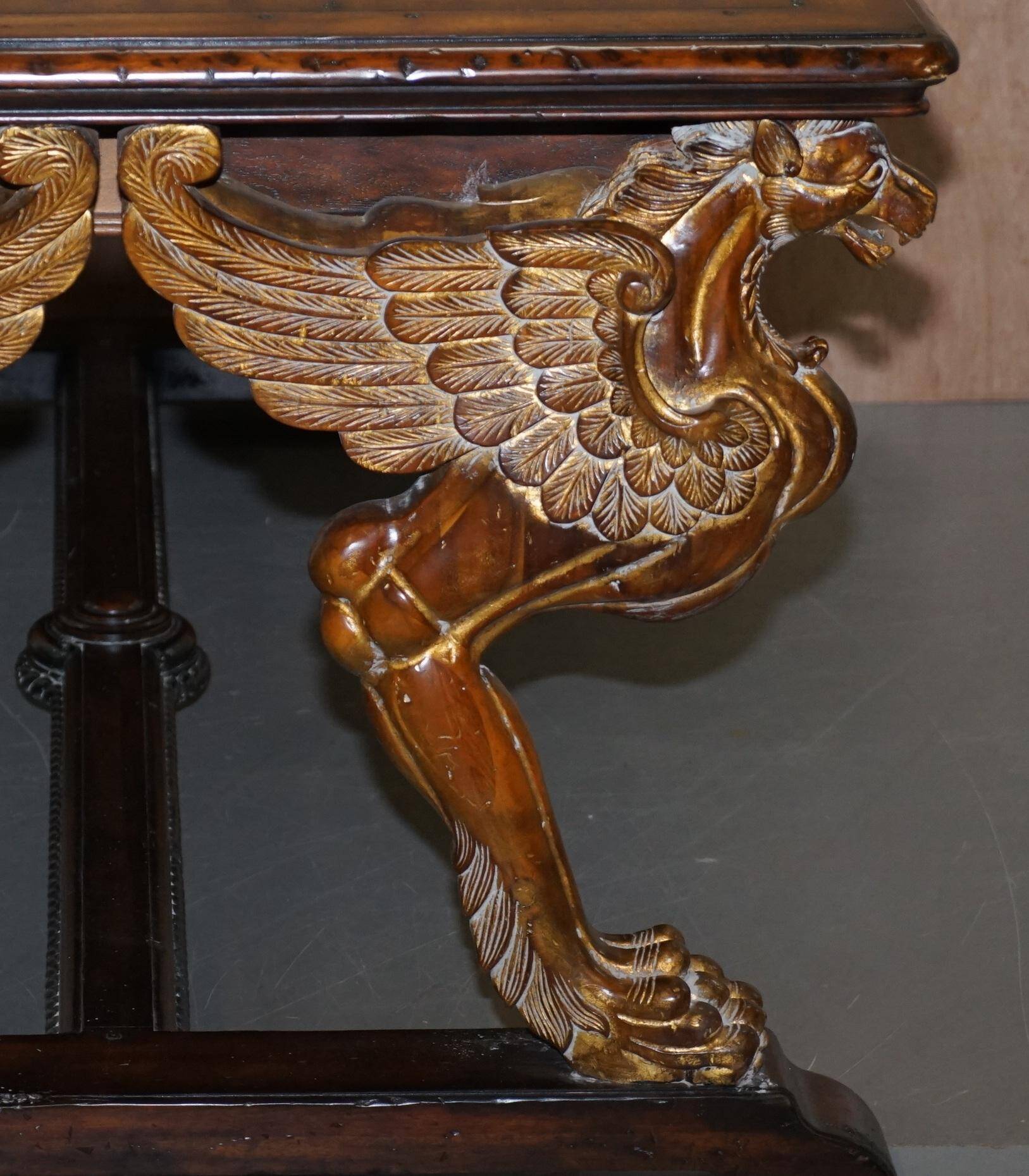Double-sided writing desk in hardwood with gilt griffins, RJ Horner style.