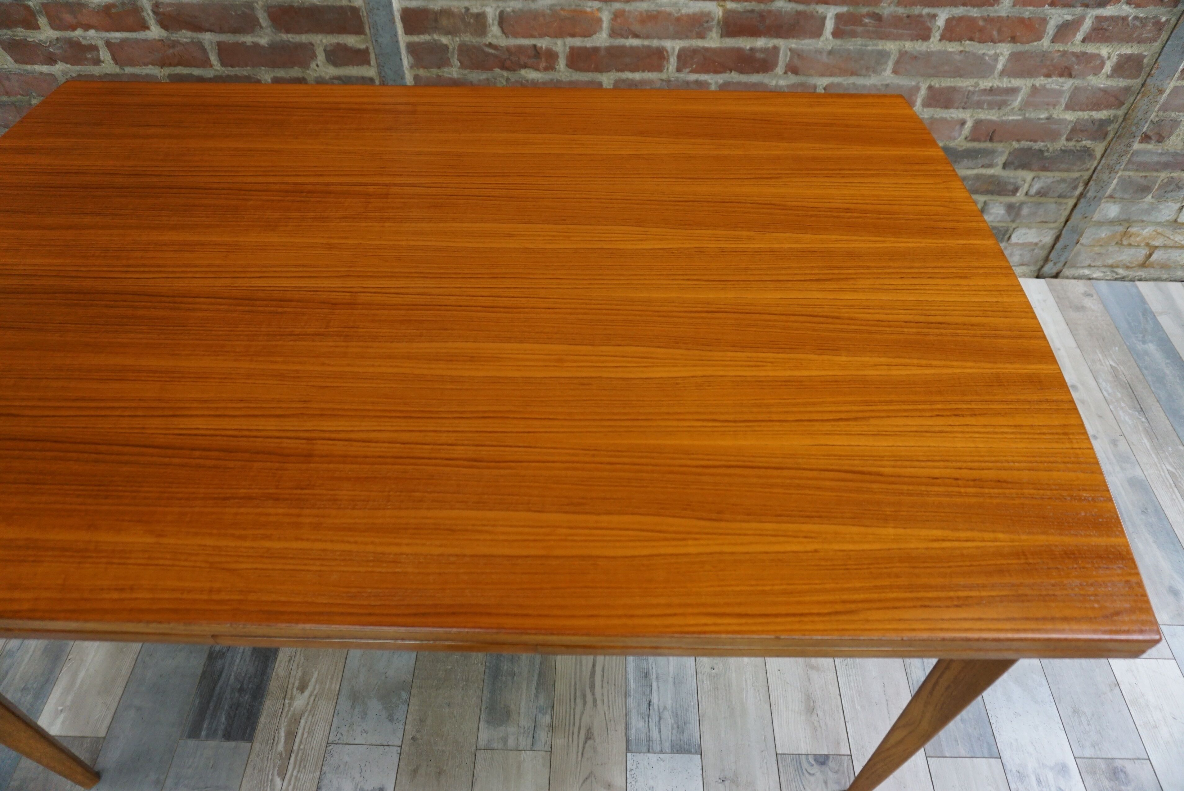 Teak dining table design by Johannes Andersen for Samcom 60s