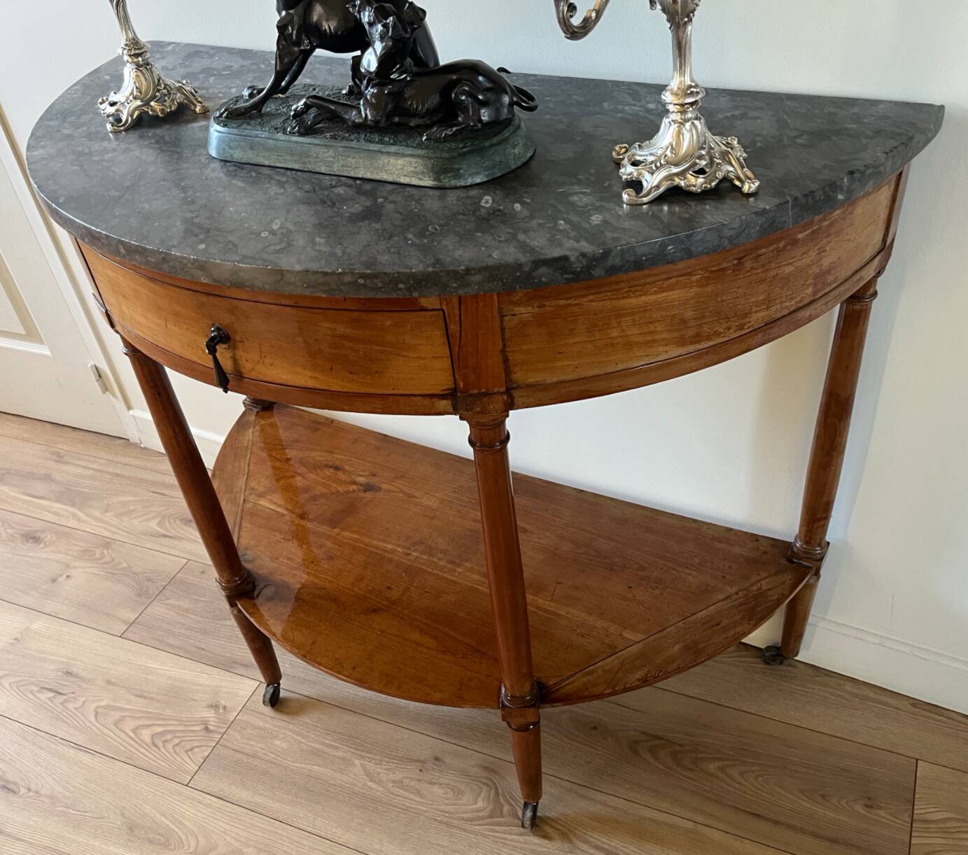 Half-moon console in mahogany with a marble top in Louis XVI style.