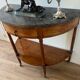 Half-moon console in mahogany with a marble top in Louis XVI style.