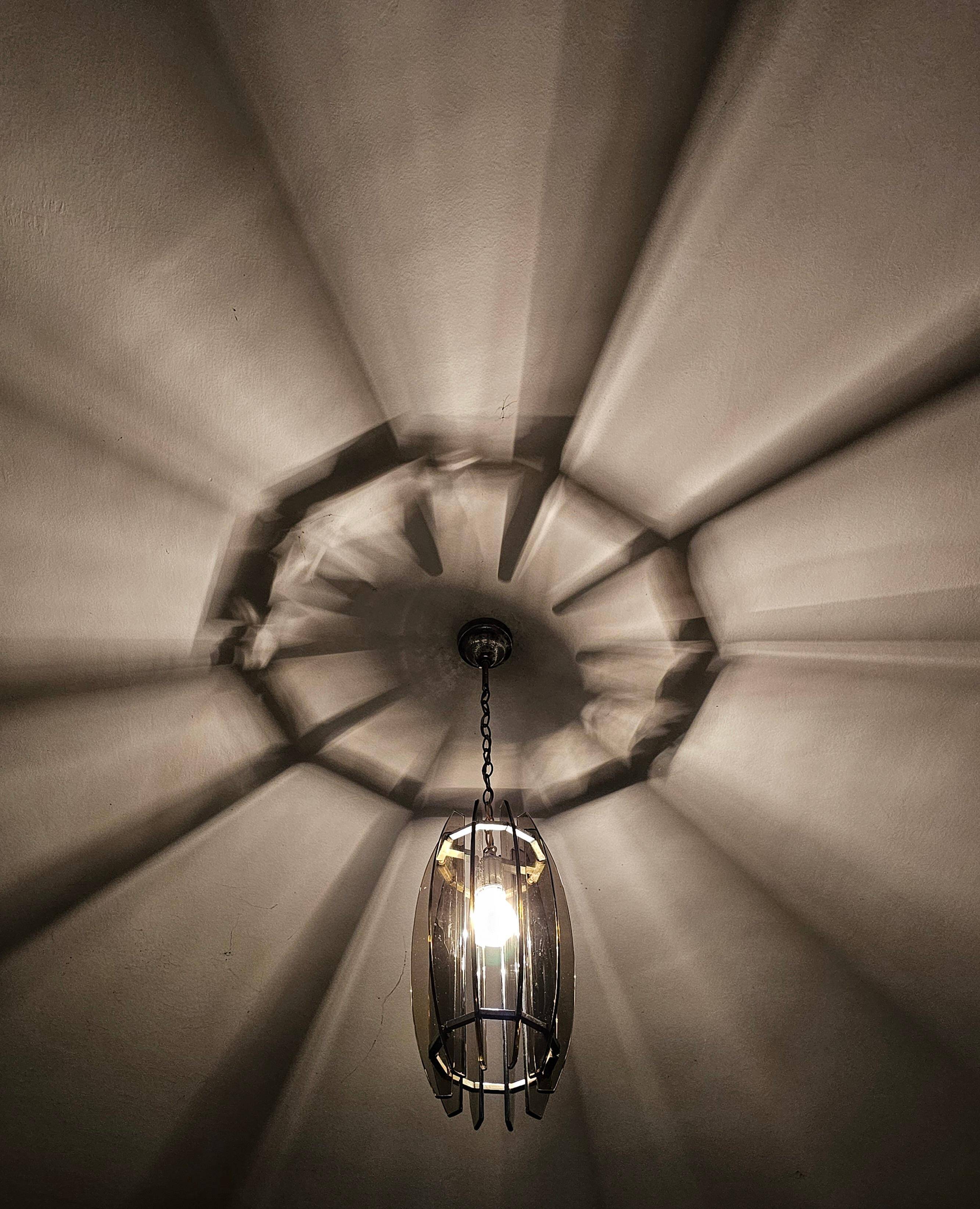Glass chandelier, chrome and smoked glass in the Fontana Arte style from the 1970s.