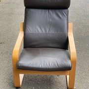 Scandinavian rocking chair in curved wood and brown leather from IKEA Poang