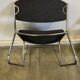 Pair of vintage armchairs in metal and grey mottled fabric.