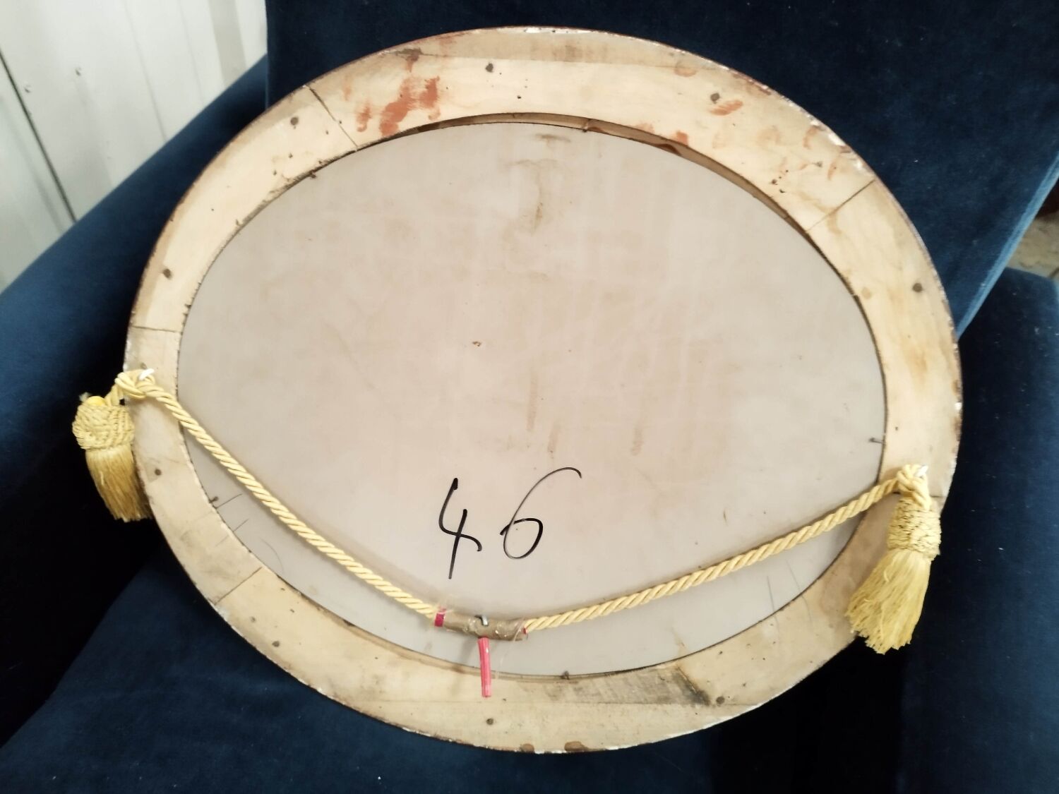 Golden oval art deco mirror