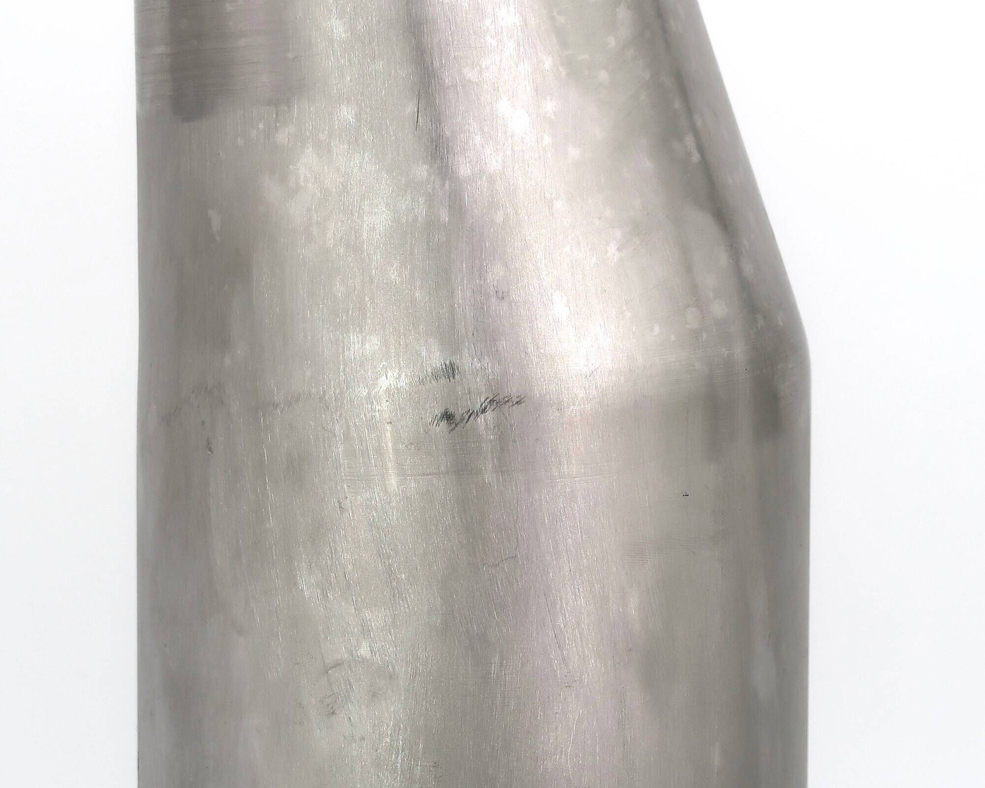Stainless steel bottle in the style of Philolaos Tloupas.