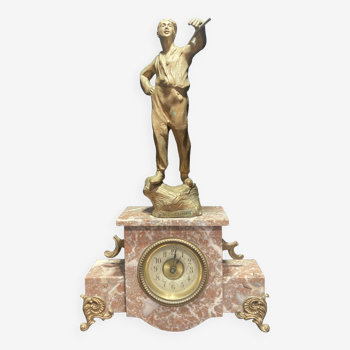 Pink marble clock topped with a character