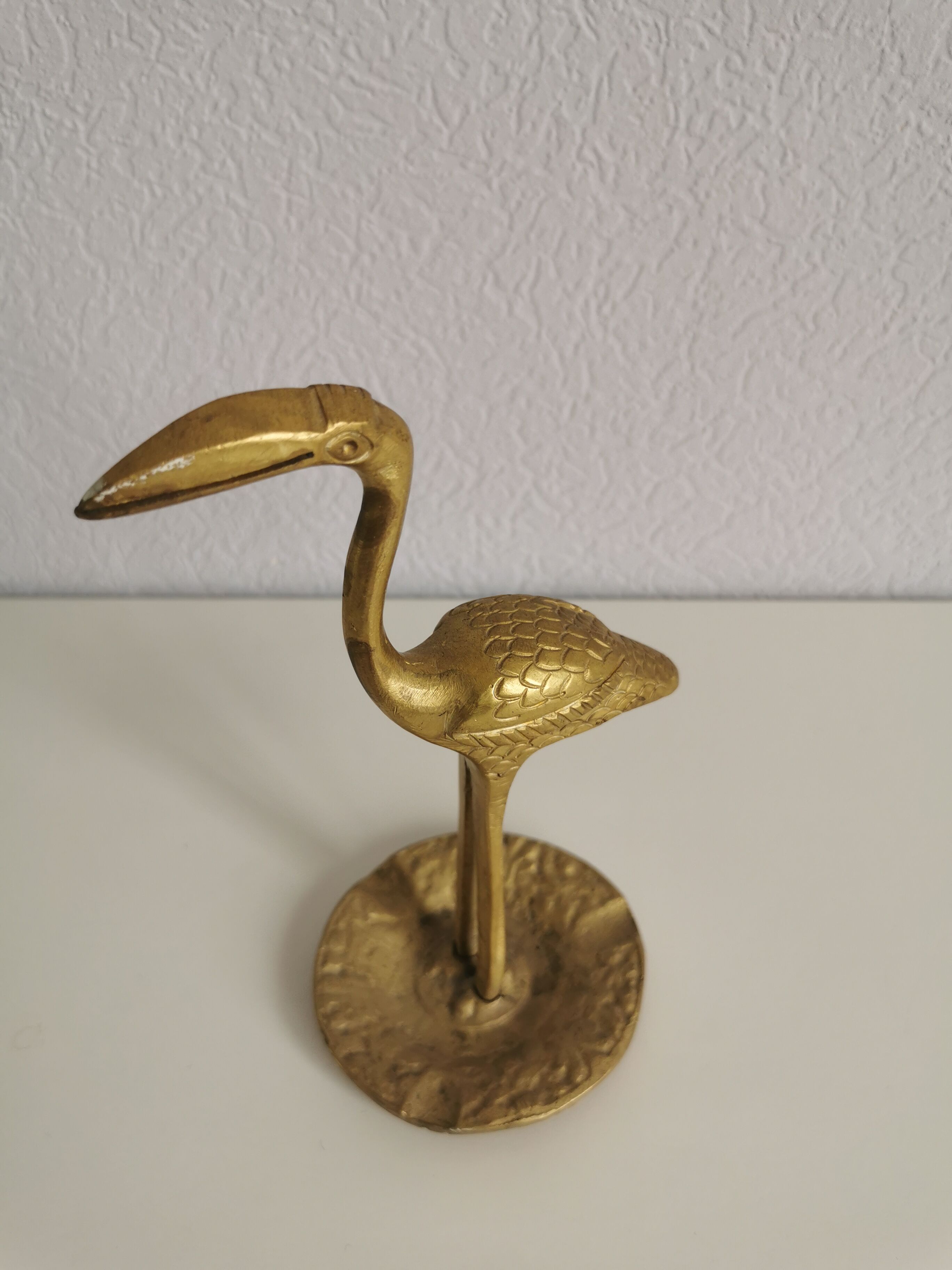Naif brass bird
