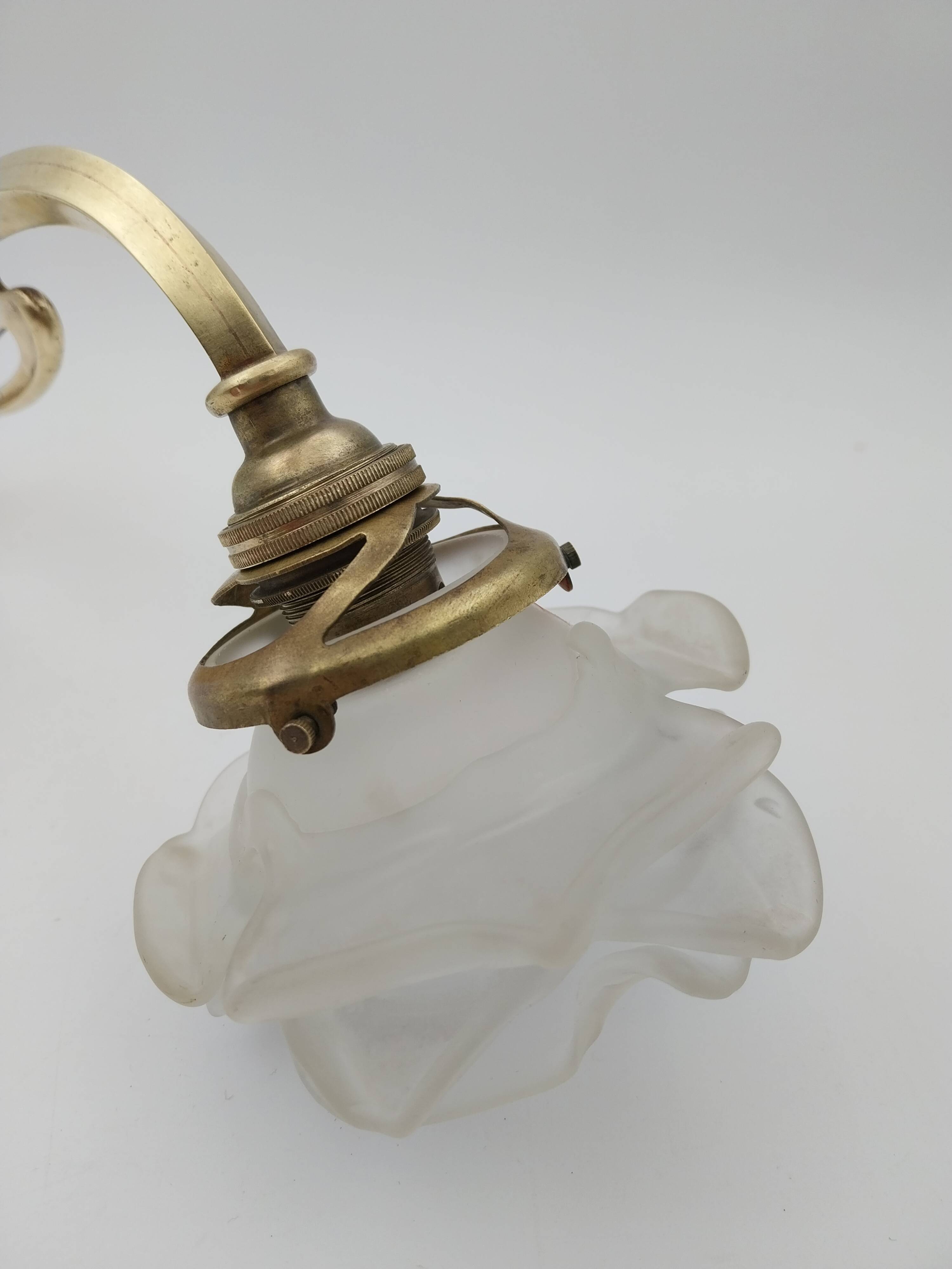 Art Nouveau bronze wall lamp with its rose-shaped glass paste tulip