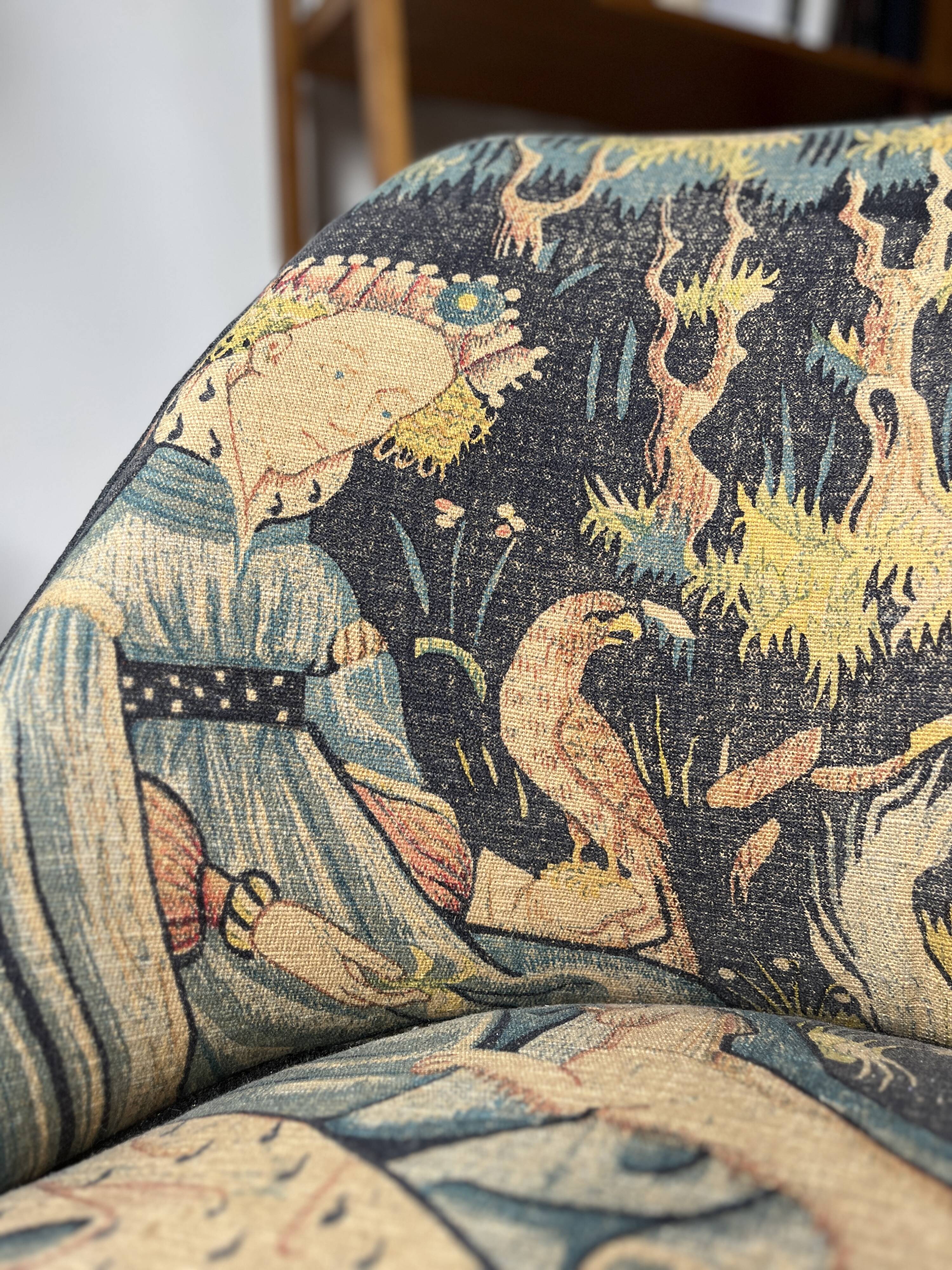 J. Tenreiro, Brazil. Concha armchair with tapered legs, Cluny tapestry 1400.
