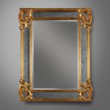 Richly decorated wall mirror in resin with golden ornaments and smoked mirror glass panels, Belgium,