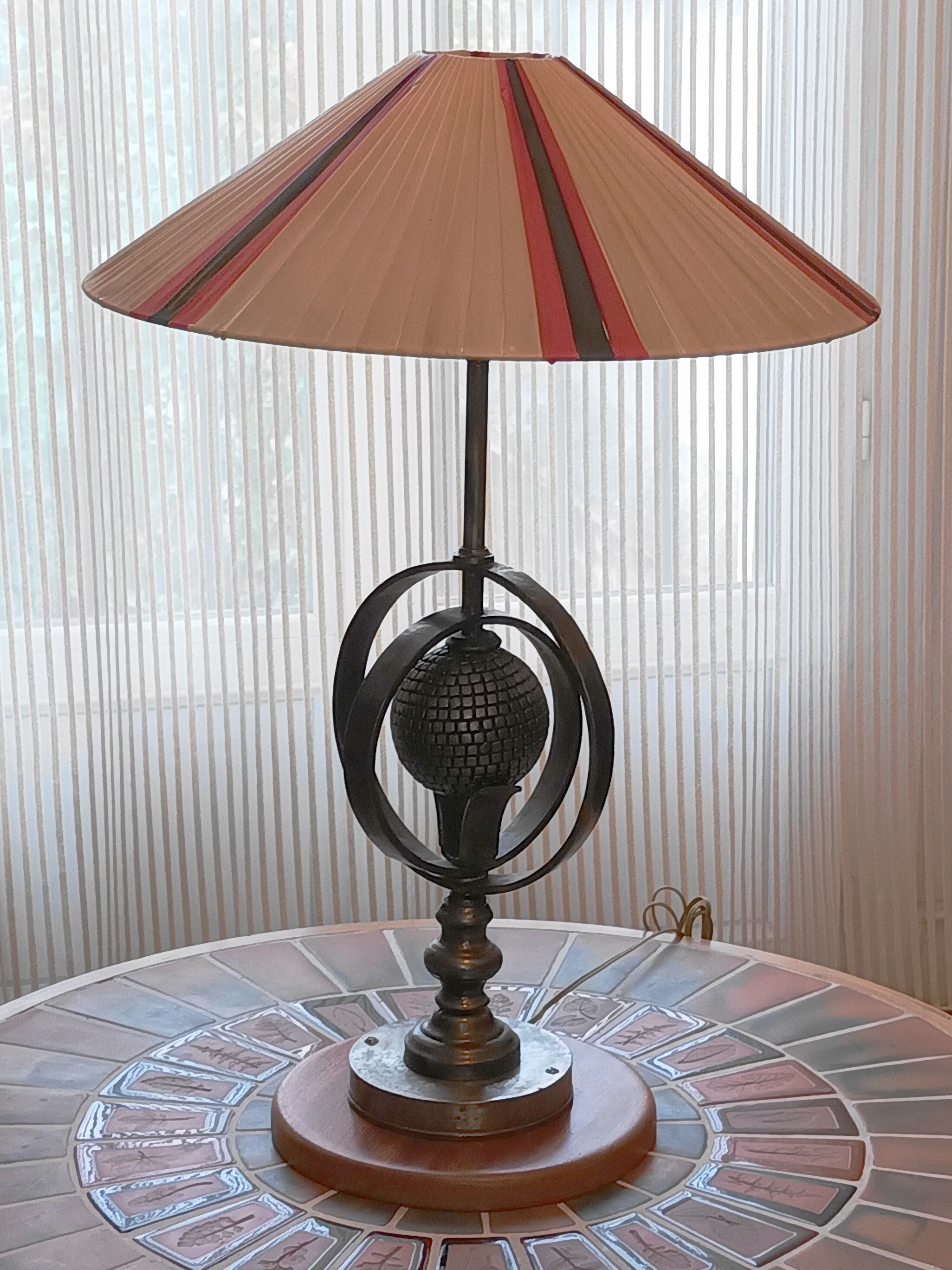 Wrought iron lamp with armillary sphere decorations
