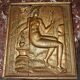 Carved oak panel depicting an allegorical female figure.
