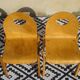 Pair of light wood chairs with post-formed seat and backrest.