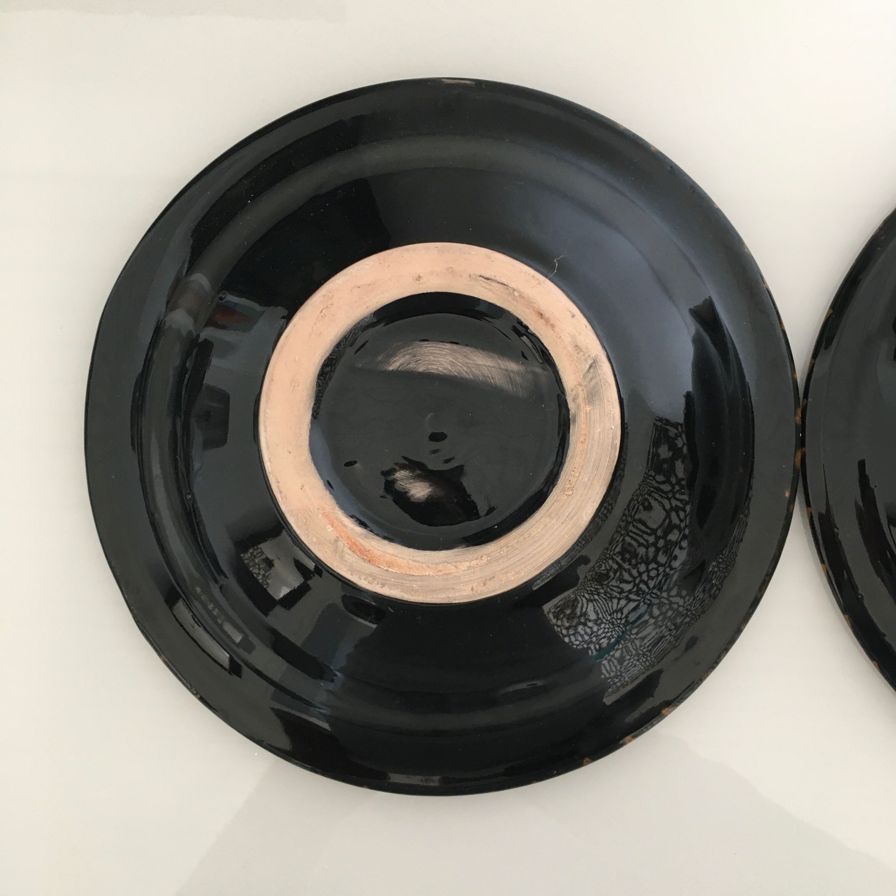 Set of 3 black decorative deep plates.