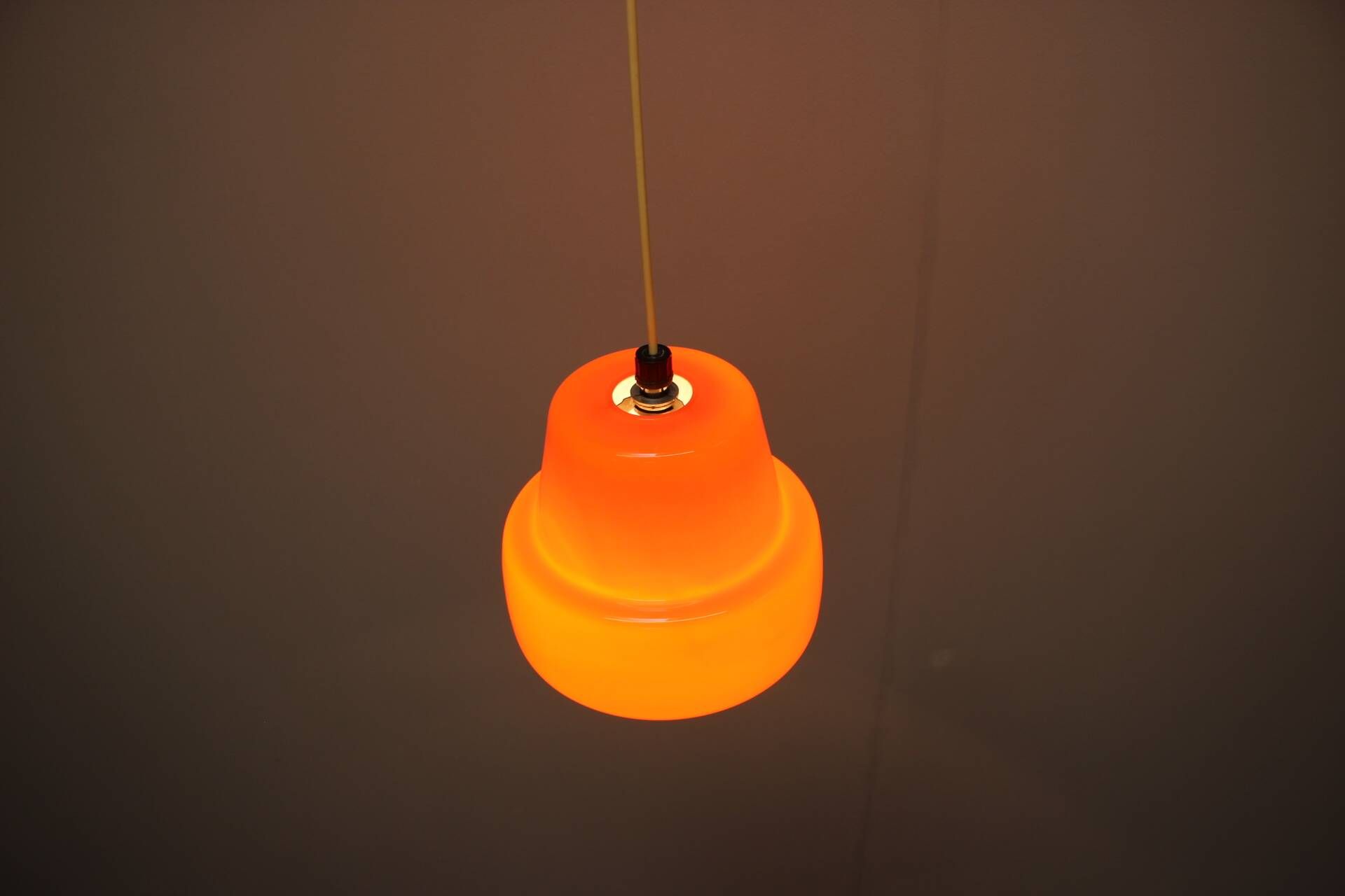 Vintage orange glass pendant lamp, Czechoslovakia, circa 1970.