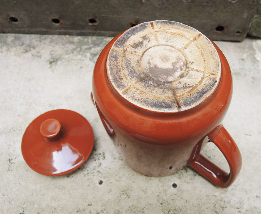 Old brown ceramic coffee maker