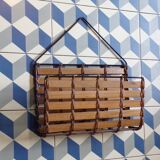 Vintage wall-mounted magazine rack