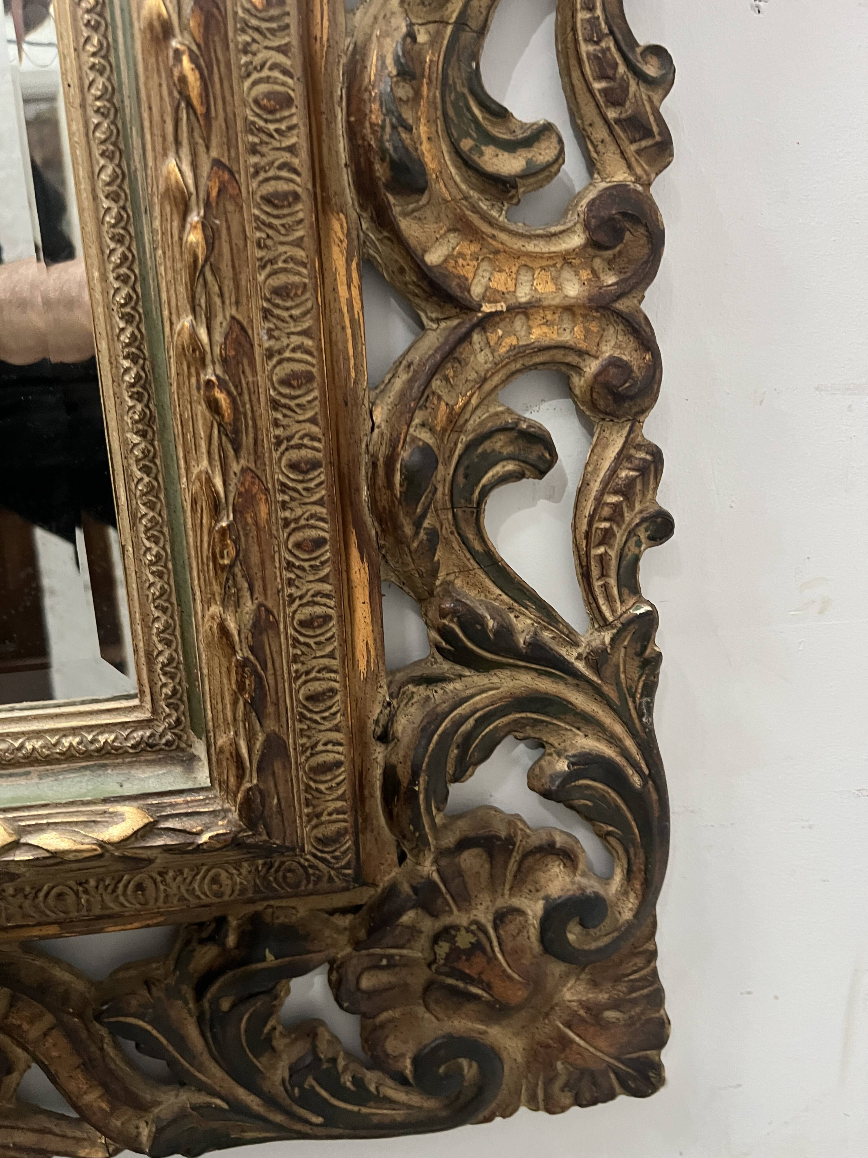 Napoleon III style mirror in carved wood, 20th century.