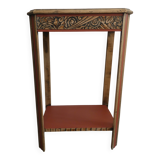 Console, small red accent table.