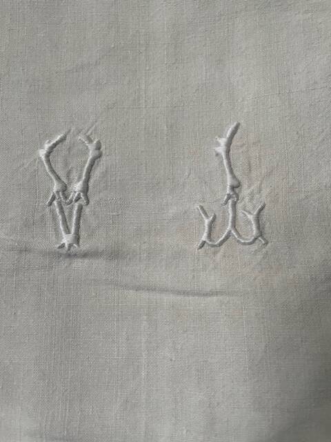 Antique linen sheet with monogram VI