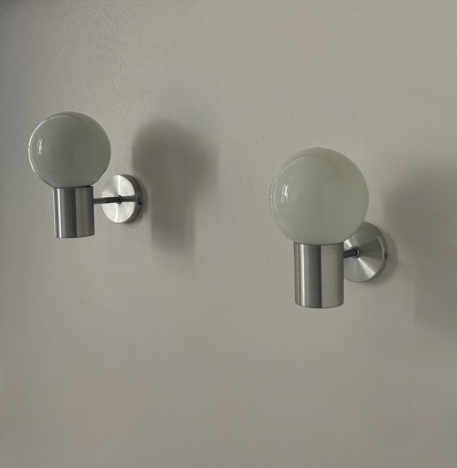 Pair of vintage wall lights, aluminum and opaline, France, 1980