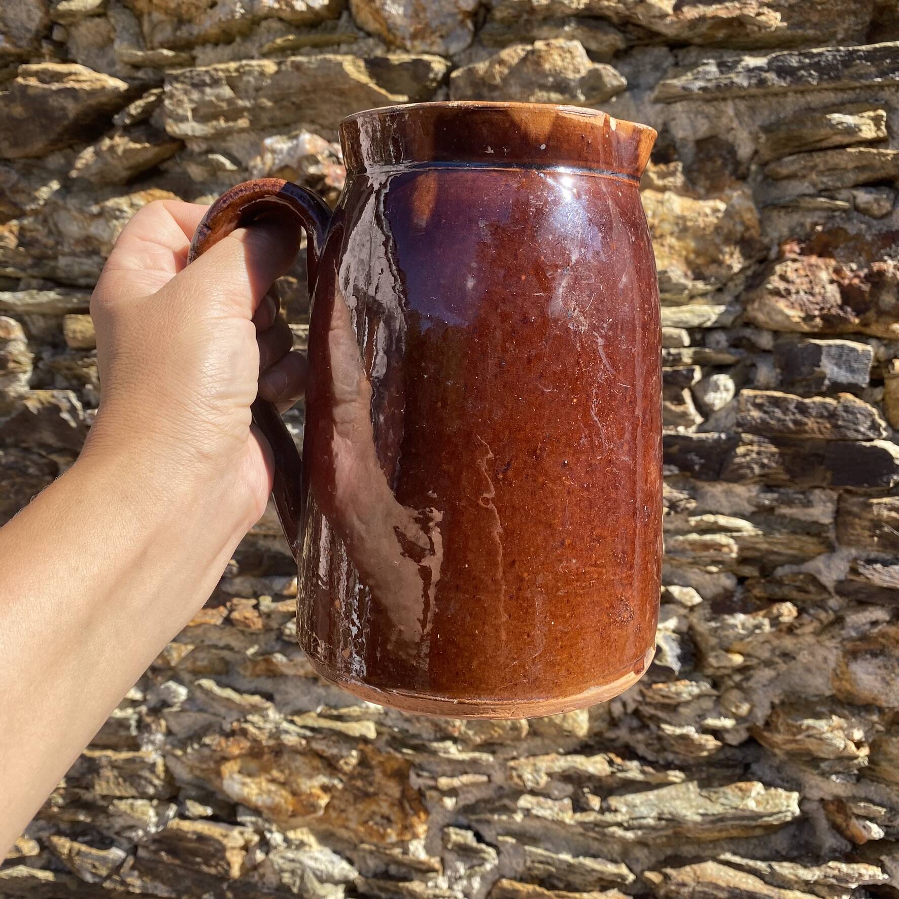 Old glazed terracotta pitcher