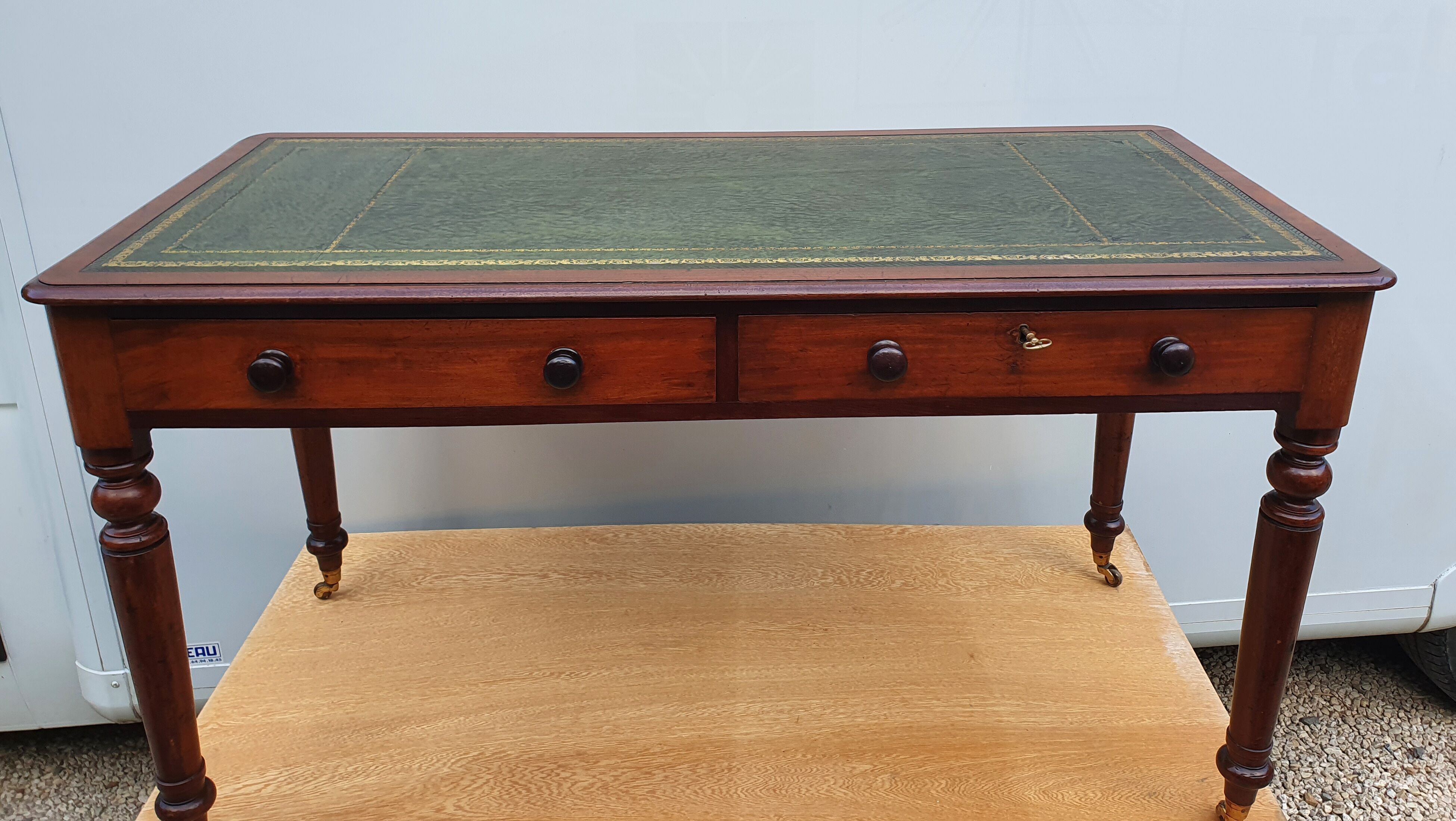 English desk with 2 drawers on green leather