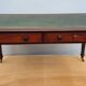 English desk with 2 drawers on green leather