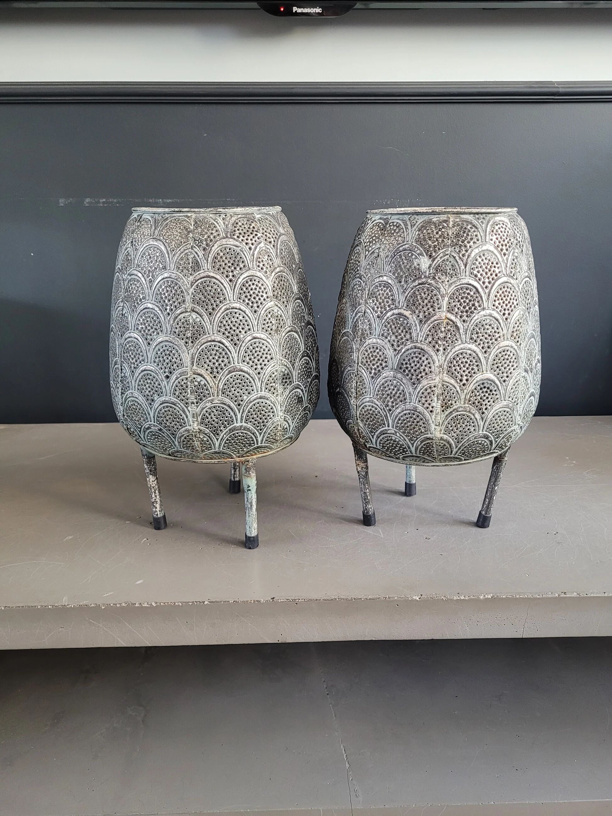 Pair of openwork metal lanterns