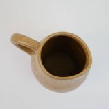 Small brown stoneware pitcher