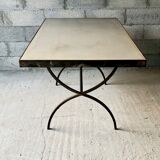 Table made of wrought iron and cement