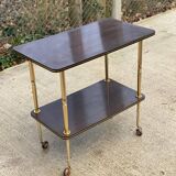 Brown rosewood rolling table with gold legs