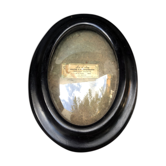 Blackened wooden oval frame