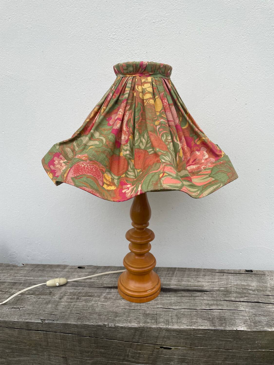 Turned wood lamp with flower shade