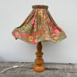 Turned wood lamp with flower shade