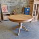 Round cherry table with 2 extensions.