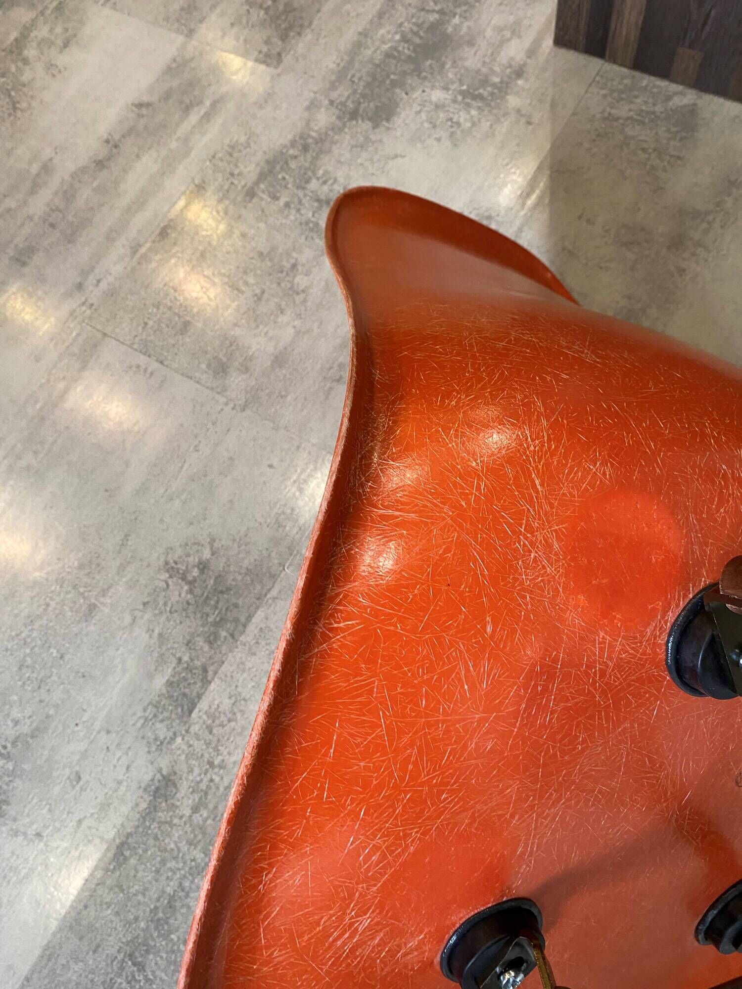 A vintage 70s Eames Herman Miller DSW Fiber Red Orange Dowel Walnut Chair