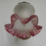 French Art Nouveau wall sconce in bronze with a white and pink glass shade.