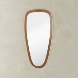 Wonderful 1950s mirror on a teak wood panel with brass frame. Made in Germany