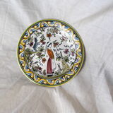 Decorative plate with medieval, Breton and rabbit decoration surrounded by plants - Breton earthenware