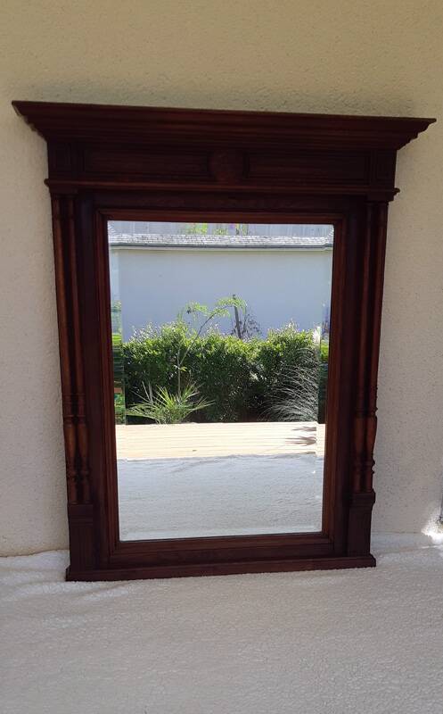 Henri II trumeau mirror for a fireplace in solid walnut.