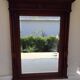 Henri II trumeau mirror for a fireplace in solid walnut.
