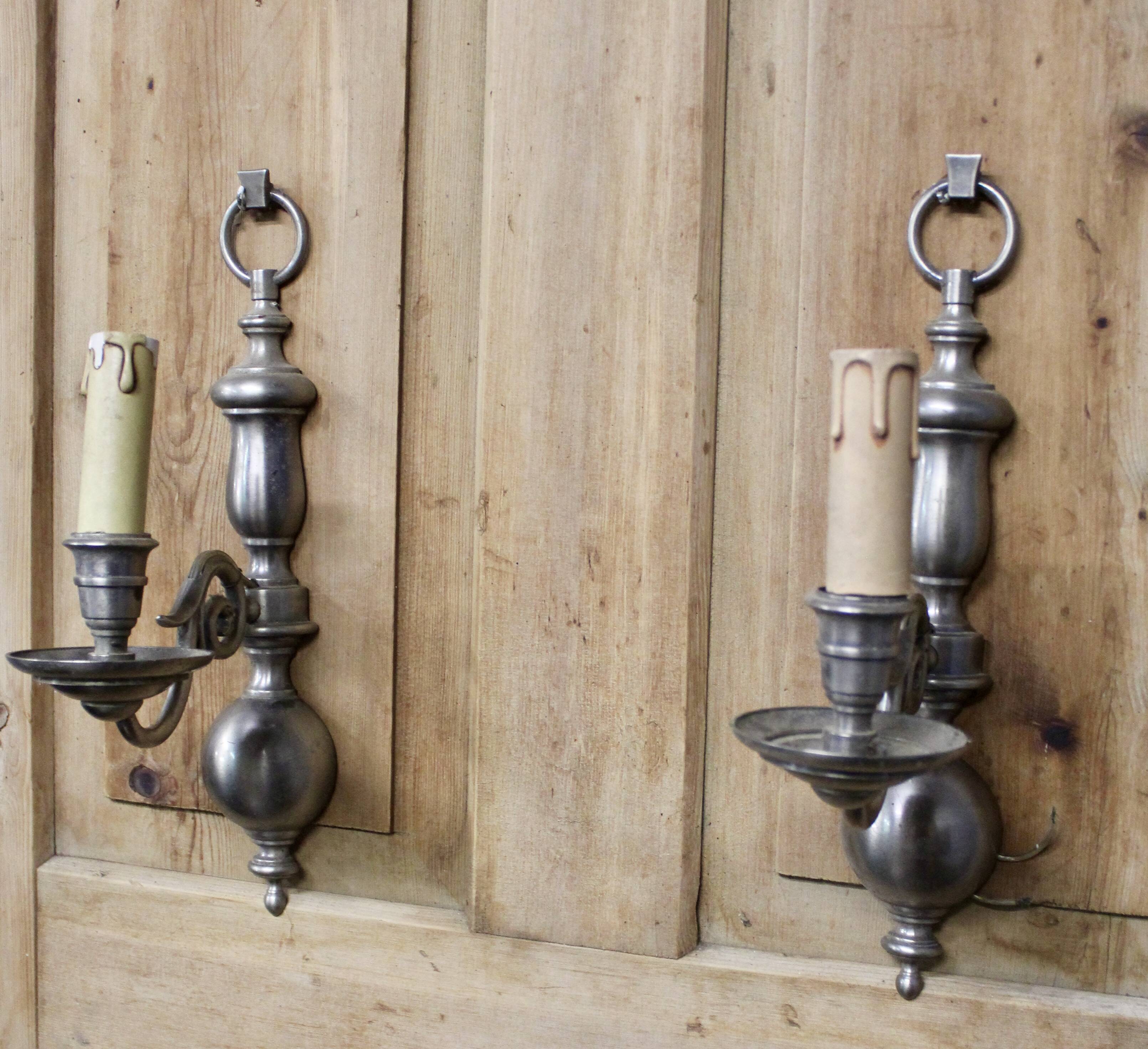 Pair of pewter-colored bronze wall sconces