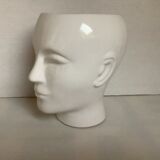 Man's head hide pot vase