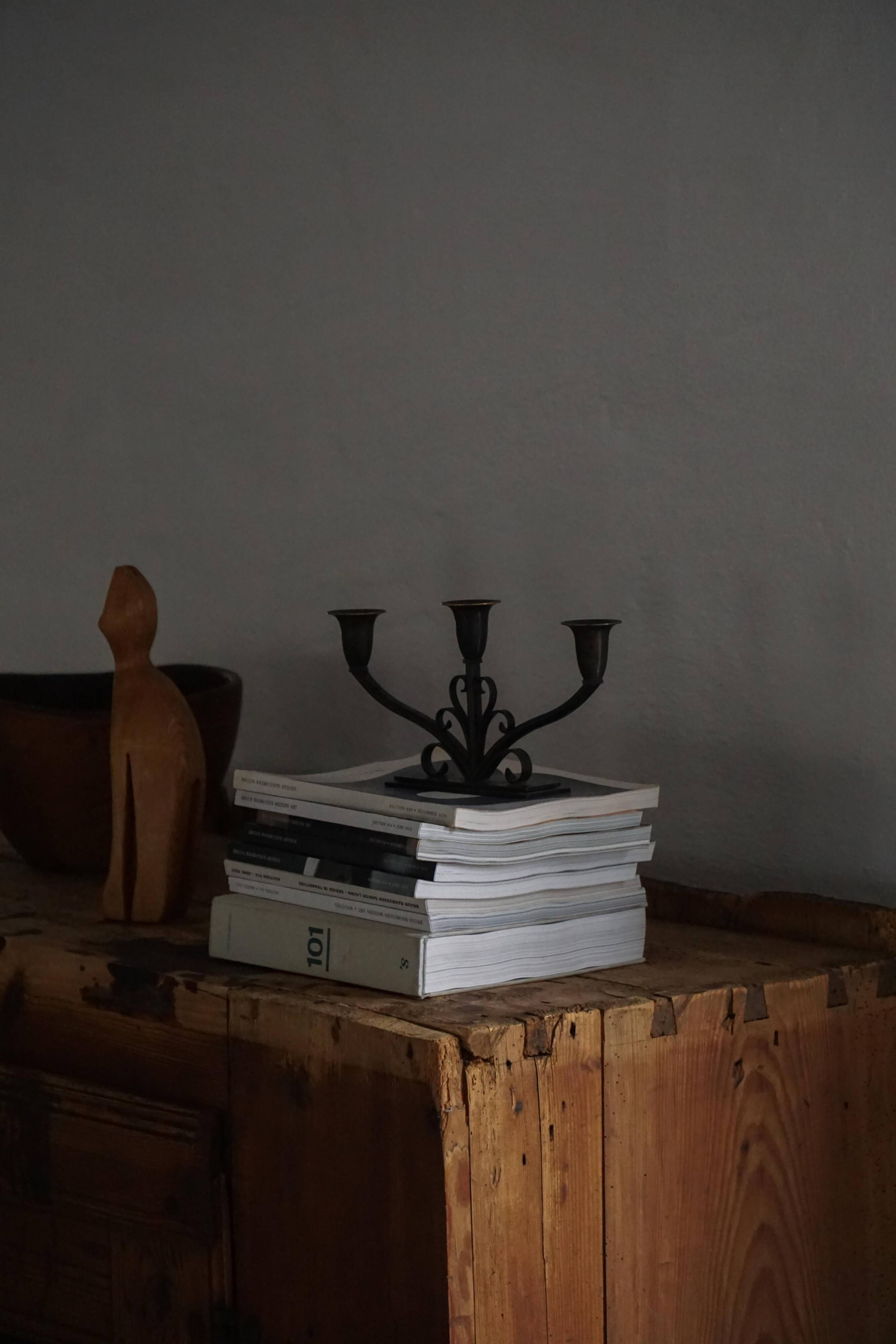 Early 20th century, pair of Danish Art Deco candlesticks in metal with three arms, 1930s.