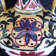 Art Deco ceramic vase with brightly colored abstract patterns