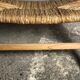 Low armchair in raw teak with seat and mulched backrest