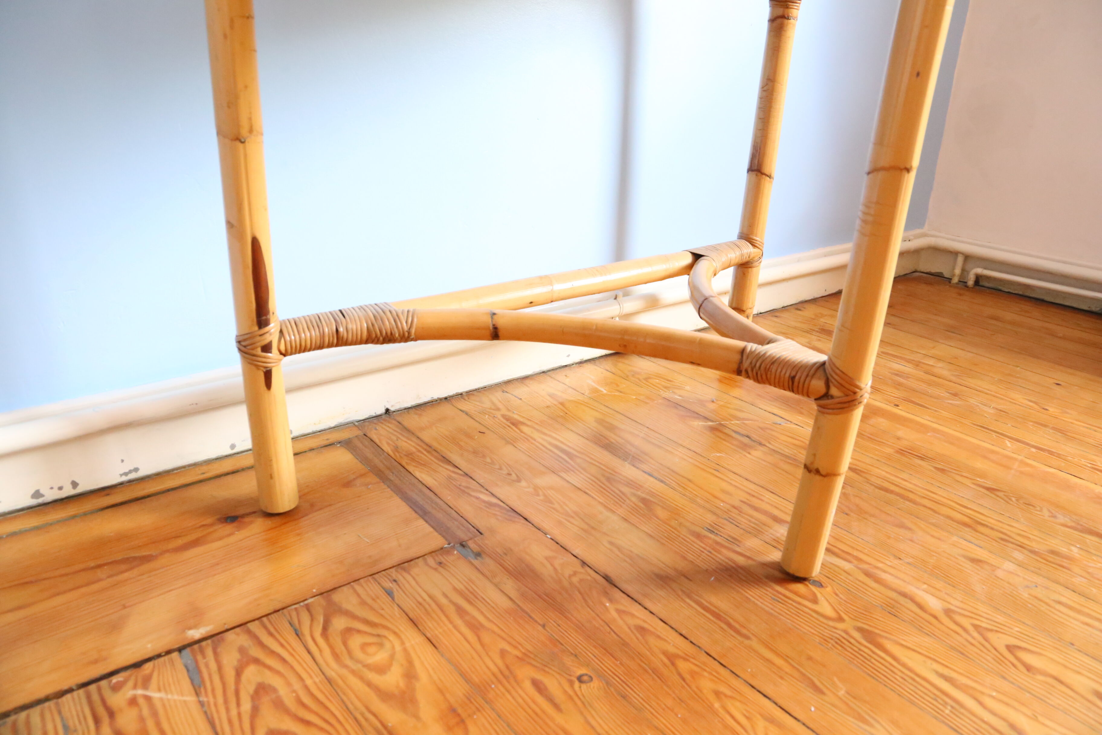 Half-moon rattan console